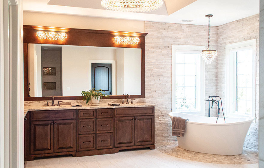 Classy door design and beautiful stain bring elegance to this master bathroom suite