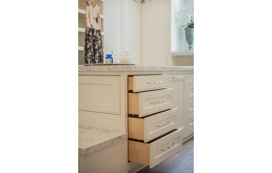 Warm white painted Hayes 3/4" (348) cabinetry is a wonderful backdrop so both your outfit and your dressing room will impress.