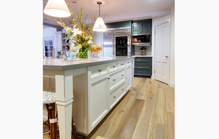 This family gathering place boasts a color palette of crisp whites and cool blues with painted cabinetry.