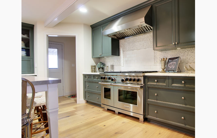 This family gathering place boasts a color palette of crisp whites and cool blues with painted cabinetry.