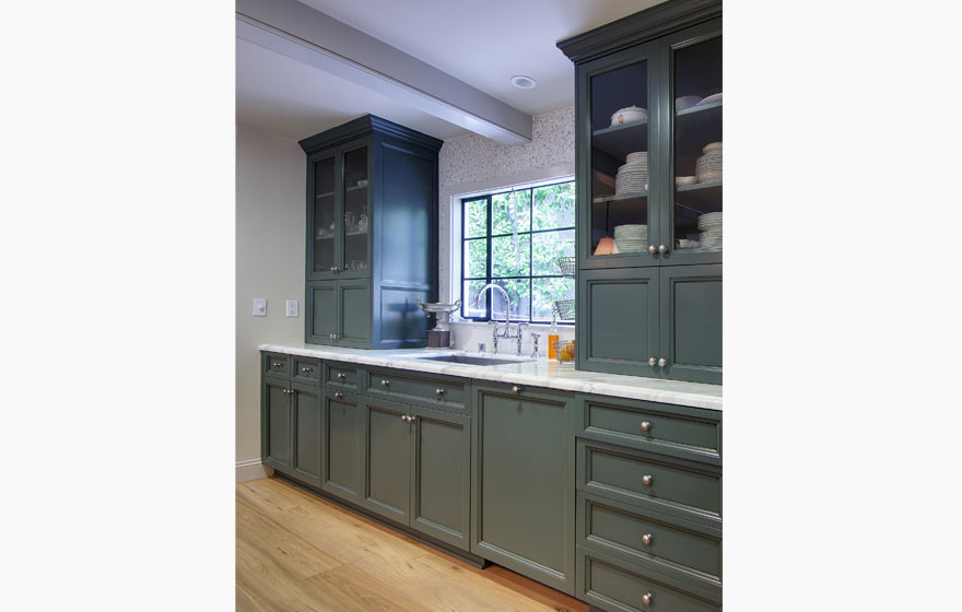 This family gathering place boasts a color palette of crisp whites and cool blues with painted cabinetry.