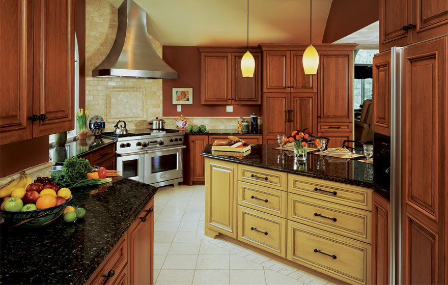 The long, angular layout and adjoining bar area provide ample cabinet storage while the cherry wood and yellow painted cabinetry pair perfectly.