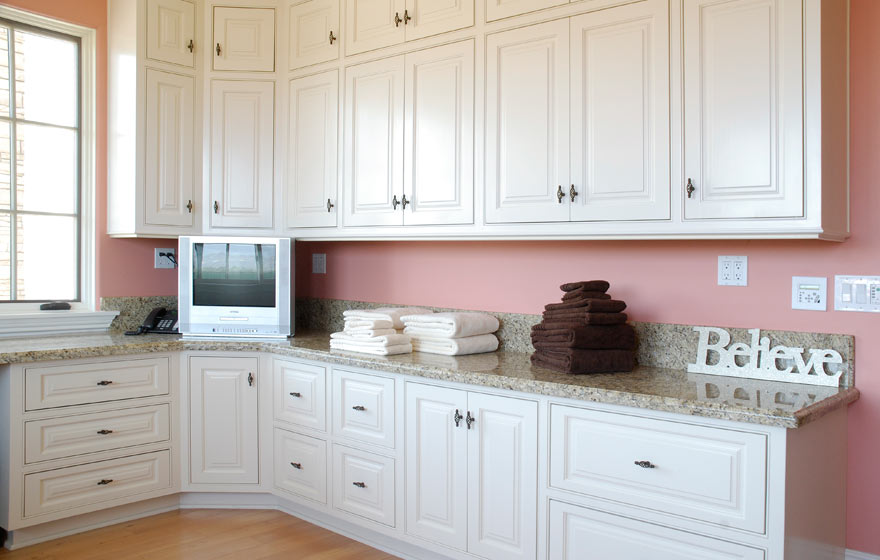 A detailed door paired with a crisp, solid white paint works well in this frequently used room in any home.