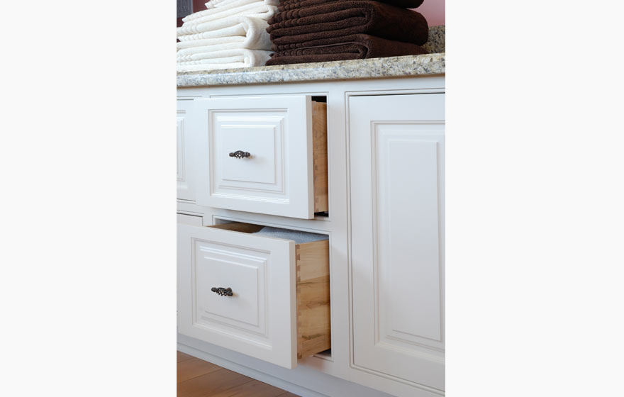 A detailed door paired with a crisp, solid white paint works well in this frequently used room in any home.