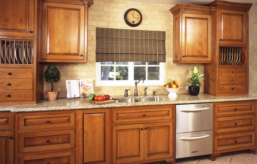 A rustic yet elegant kitchen that can handle the comings and goings of a busy family while utilizing the long floor plan to provide ample storage space. 