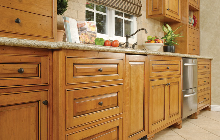 A rustic yet elegant kitchen that can handle the comings and goings of a busy family while utilizing the long floor plan to provide ample storage space. 