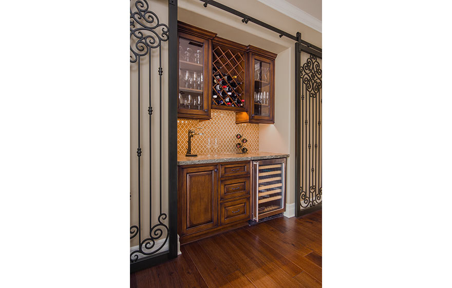 Tucked into a nook in the wall, this custom built-in wine area is both functional and beautiful.