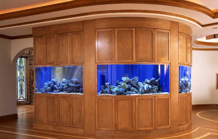 This entry area makes a dramatic statement with radius fish tanks supported with a classic, Shaker 3/4" (831) Door. 