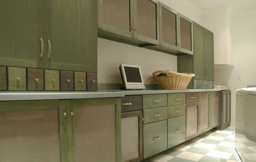 Fun color combinations and a simplistic and stylish door style create an excellent backdrop for this basement laundry area. 