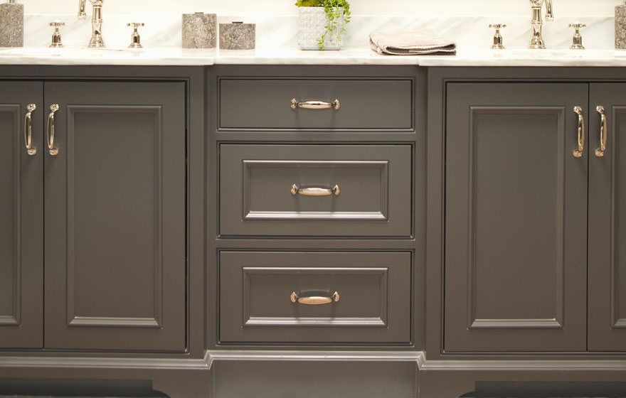 The gorgeous contrast of dark cabinetry and light countertops makes a strong statement.